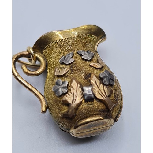 347 - Antique 18ct gold jug charm, weight 3.9g and length 2cms