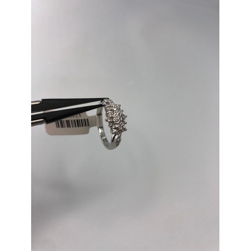 302 - 9k white gold cluster ring with 0.27ct diamonds, weight 2.5g and size L1/2 (ECN479)