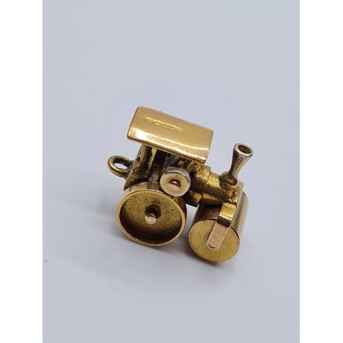 344 - 2 9ct gold charms, 1 steam roller and 1 boot, weight 5.4g