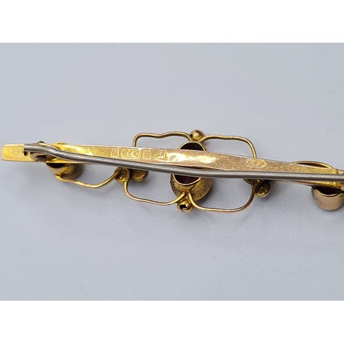 508 - Edwardian 9ct gold bar brooch with garnets and seed pearls, weight 1.8g & length 4.5cms