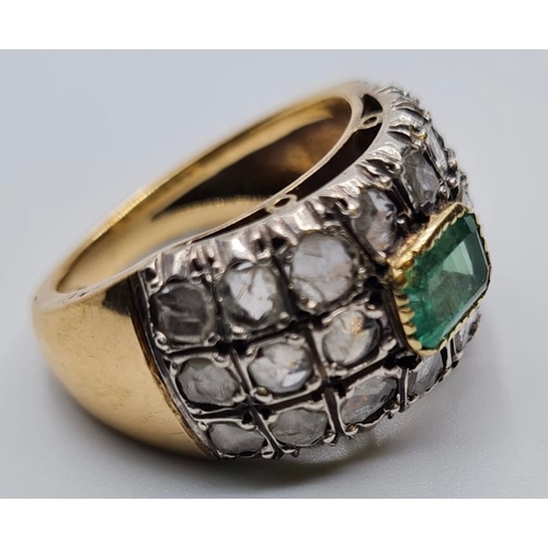 509 - Emerald and diamond ring in 18ct gold, weight 9.6g and Size S