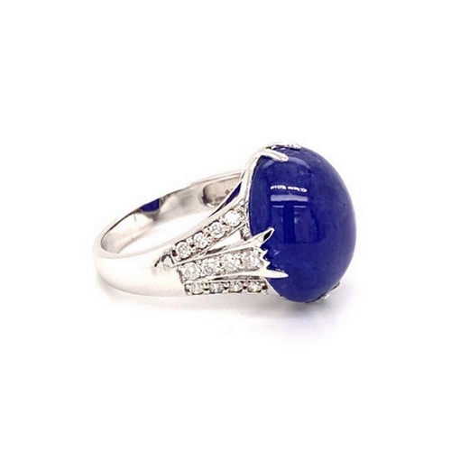 313 - 18k white gold ring with 9.11ct oval cabochon tanzanite stone and 3 rows of 0.42ct diamonds (G/I, SI... 