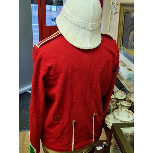 184 - A Repro Zulu Wars Tunic & Helmet as Worn at Rorkes Drift.