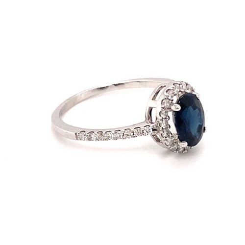 301 - 18k white gold ring with 1.20ct oval natural blue sapphire (Madagascar)  halo and 0.35ct diamonds (G... 