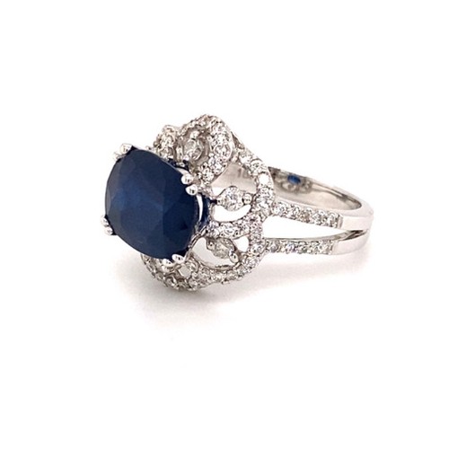 288 - 18k white gold ring with 3.25ct oval natural blue sapphire flower design halo and 2 rows of 0.69ct d... 