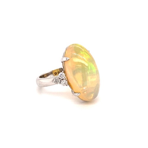 268 - 18k white gold ring with 8ct oval Ethiopian Opal cabochon with 3 diamonds on each side (total 0.47ct... 