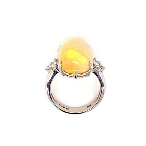 268 - 18k white gold ring with 8ct oval Ethiopian Opal cabochon with 3 diamonds on each side (total 0.47ct... 