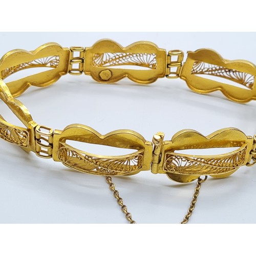 516 - 18ct gold filigree bracelet, weight 14.7g and 24cm long approx