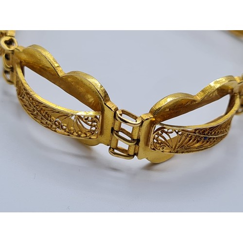 516 - 18ct gold filigree bracelet, weight 14.7g and 24cm long approx