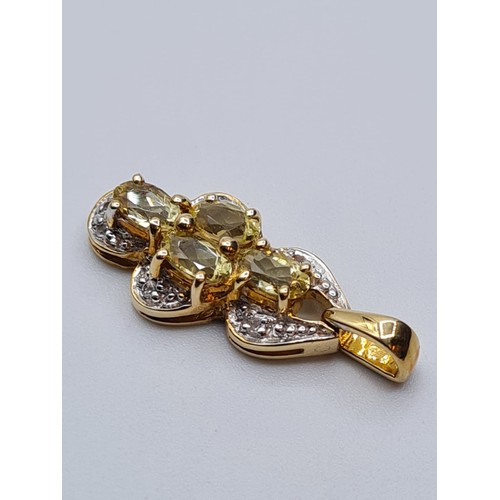 621 - 9ct gold pendant encrusted with diamonds and having 4 citrine stones, weight 2.4g