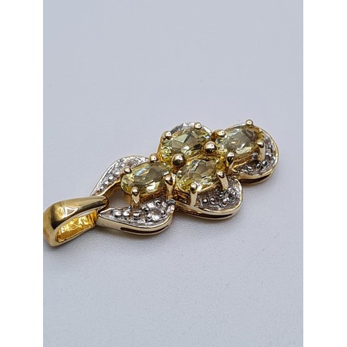 621 - 9ct gold pendant encrusted with diamonds and having 4 citrine stones, weight 2.4g