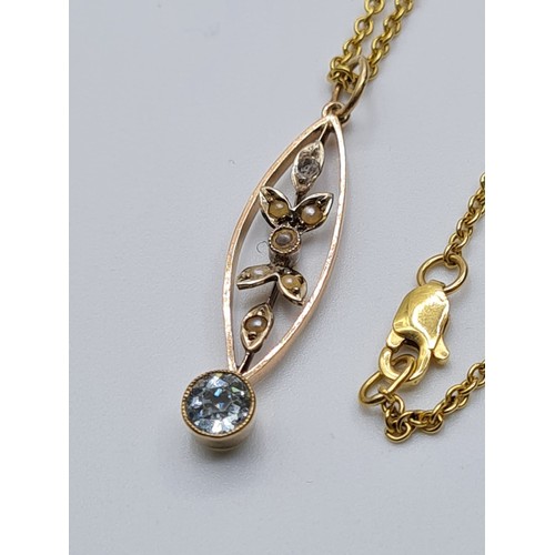 517 - An aquamarine and seed pearl 9ct pendant on a 40cm 18ct gold necklace, weight 4.2g