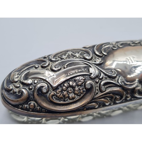 257 - Vintage Cut Glass and Silver Dressing Table Trinket Box. Having a long oval for with embossed flora ... 