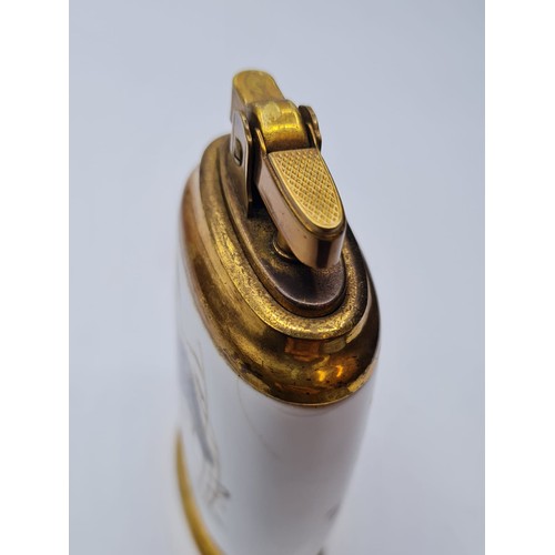 283 - Vintage Ceramic Table Lighter. Having birds to back and front. Flat oval shape, Gilded Metal.