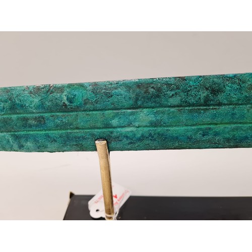 13 - An Archaic Mesopotamian sword blade. Late bronze age (1200-800 B.C.). On a custom made base. Conditi... 