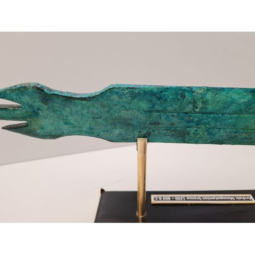13 - An Archaic Mesopotamian sword blade. Late bronze age (1200-800 B.C.). On a custom made base. Conditi... 