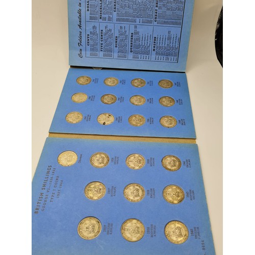 299 - A collection of 71 British shillings in 2 folders 1936 - 1966