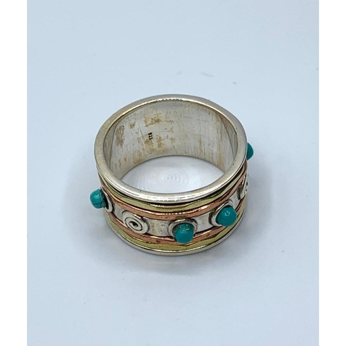 236 - A sterling silver ring with turquoise gemstones and matching dangler earrings