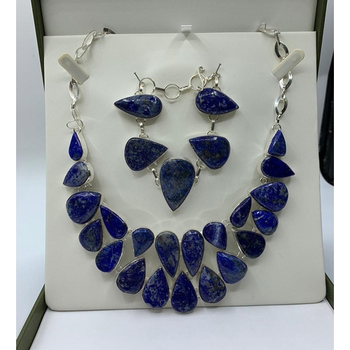 35 - A lapis lazuli necklace and bracelet set in a presentation box. White metal stamped “925”. Necklace ... 