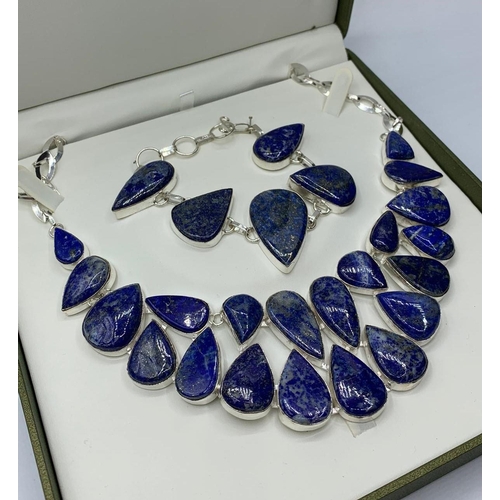 35 - A lapis lazuli necklace and bracelet set in a presentation box. White metal stamped “925”. Necklace ... 