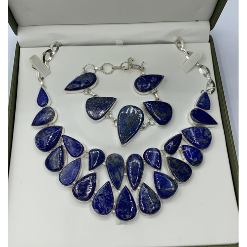 35 - A lapis lazuli necklace and bracelet set in a presentation box. White metal stamped “925”. Necklace ... 