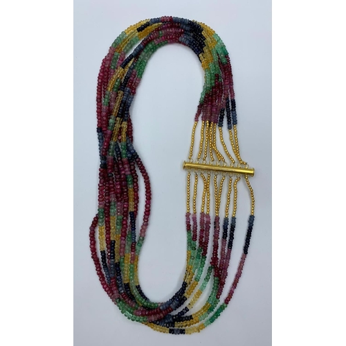 47 - A beautiful, nine rows, of ruby, emerald and sapphire faceted beads,necklace. Approximately 1900 pre... 