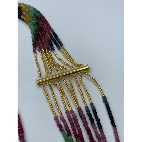 47 - A beautiful, nine rows, of ruby, emerald and sapphire faceted beads,necklace. Approximately 1900 pre... 