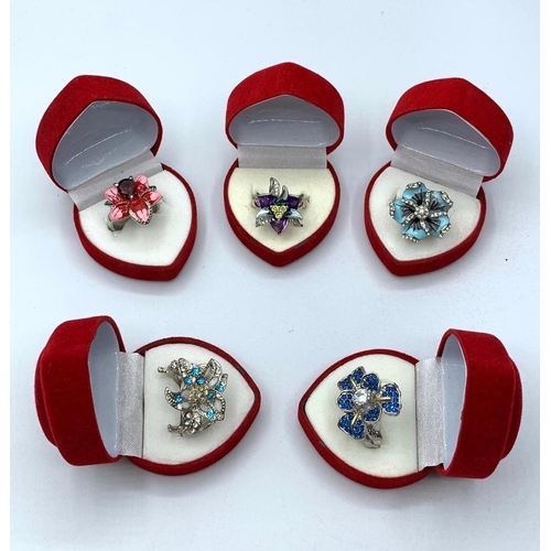 68 - Five silver (stamped “925”) floral rings with enamel and gems in heart shaped red velvet presentatio... 