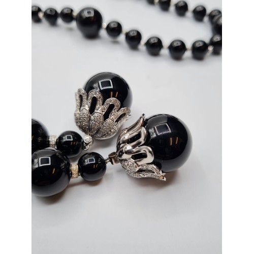 429 - Black Onyx and white gold necklace, 207g and 105cm long