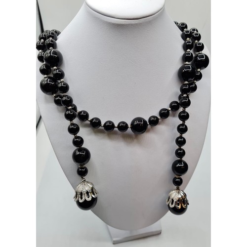 429 - Black Onyx and white gold necklace, 207g and 105cm long