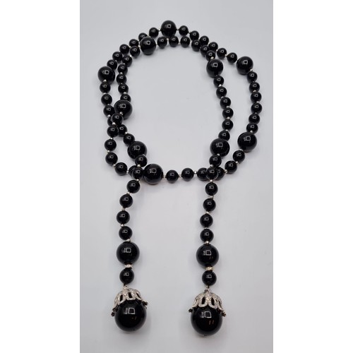 429 - Black Onyx and white gold necklace, 207g and 105cm long