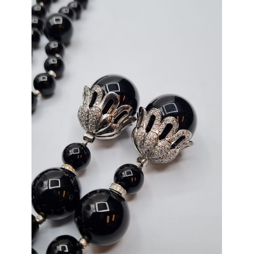 429 - Black Onyx and white gold necklace, 207g and 105cm long