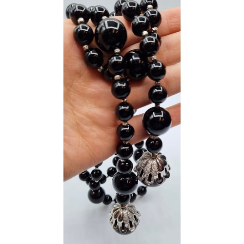 429 - Black Onyx and white gold necklace, 207g and 105cm long