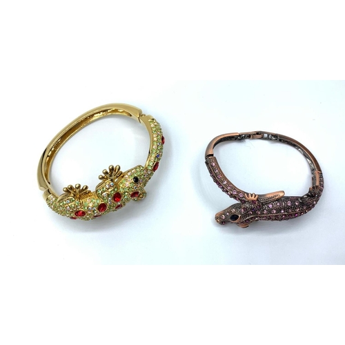 90 - Two bracelets, one yellow metal, representing a Gecko with green and red crystals and the other one,... 