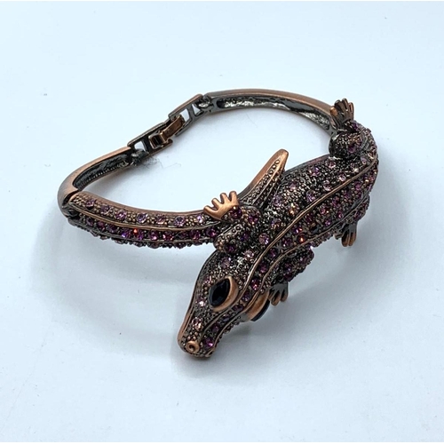 90 - Two bracelets, one yellow metal, representing a Gecko with green and red crystals and the other one,... 