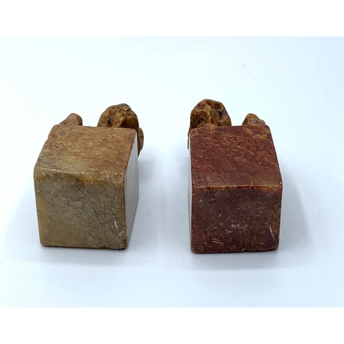 99 - An antique, near pair, Chinese, hand carved, seal stones of fu dogs. Height: 4.5 & 5cm.