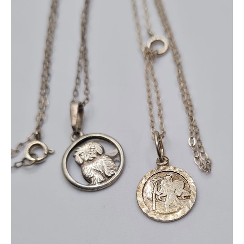 439 - 2 Silver Pendant on Necklaces, one St Christopher and one of a Dog. 3.1g