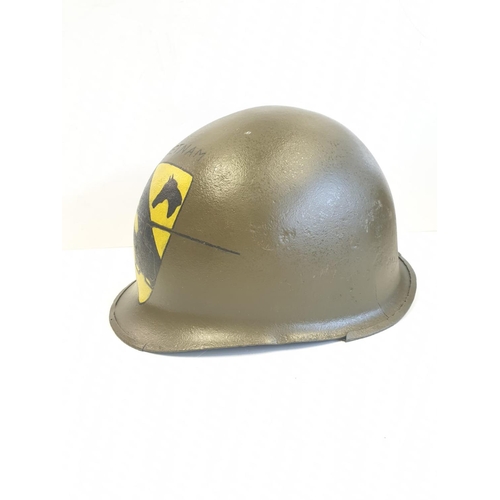 66 - Vietnam War Era M1 Helmet. The Helmet was found in a flea market in Saigon and painted recently with... 