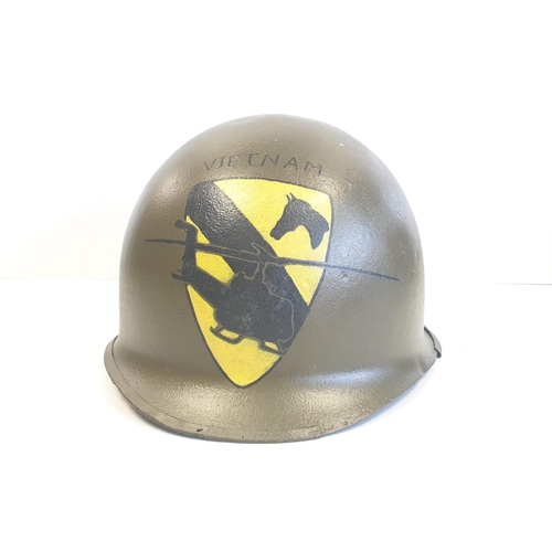 66 - Vietnam War Era M1 Helmet. The Helmet was found in a flea market in Saigon and painted recently with... 