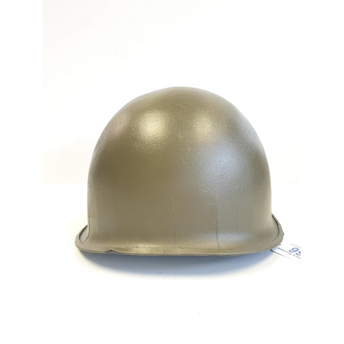 66 - Vietnam War Era M1 Helmet. The Helmet was found in a flea market in Saigon and painted recently with... 