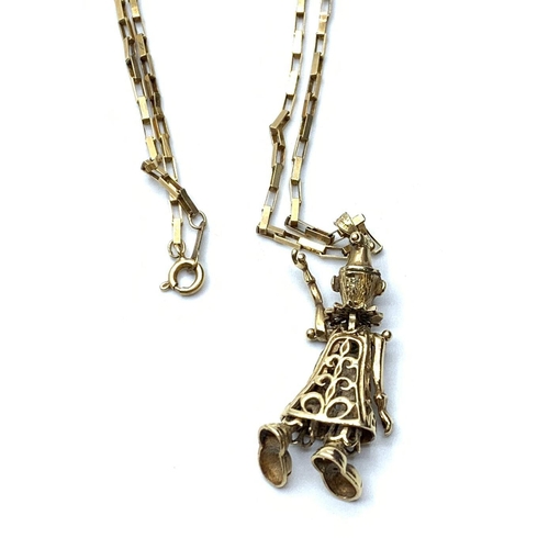 154 - Gold doll on gold chain, weight 11.2g