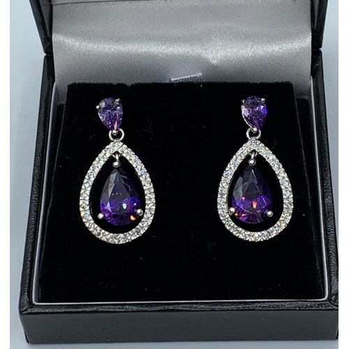 390 - Silver earring with purple stones