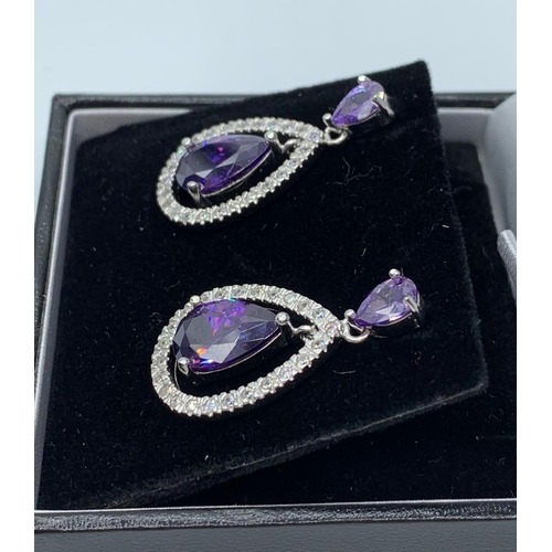 390 - Silver earring with purple stones