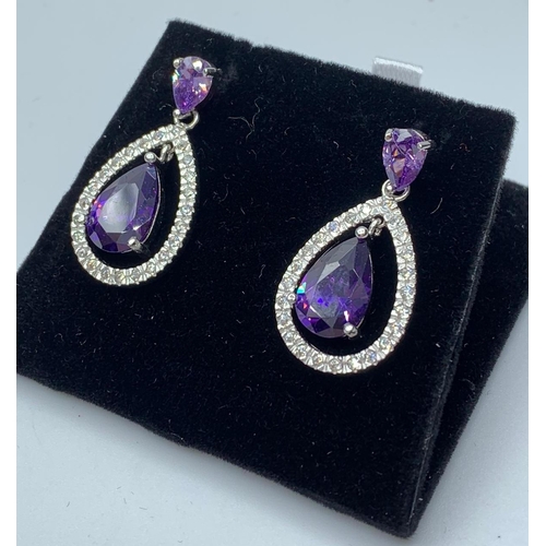 390 - Silver earring with purple stones