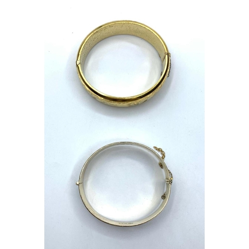 394 - Rolled gold bangle & a silver + gold bangle, weight 68g