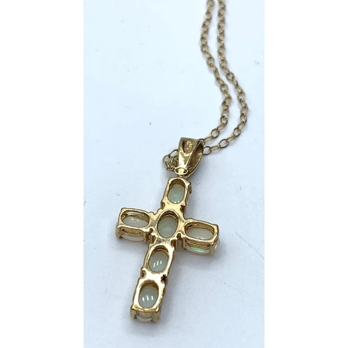 395 - 9ct gold opal cross