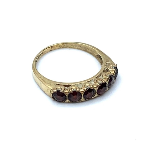 342 - 9ct gold ring with 6 garnet stones, weight 2.6g & size P