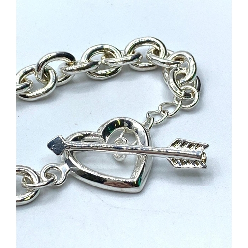 378 - Silver bracelet with heart & arrow fastener, weight 30g & length 18cms