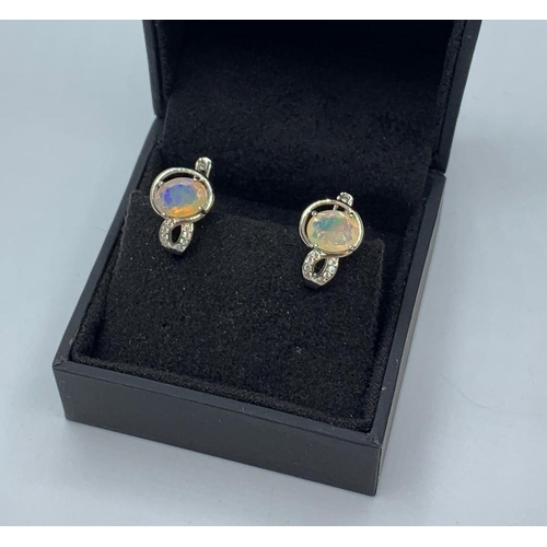 450 - 925 Sterling Silver Opal Earrings Set with White Stones.