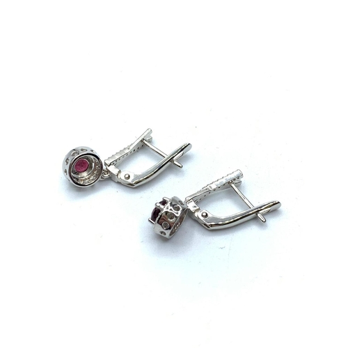 454 - 925 Sterling Silver Set with Garnets and White Stones.